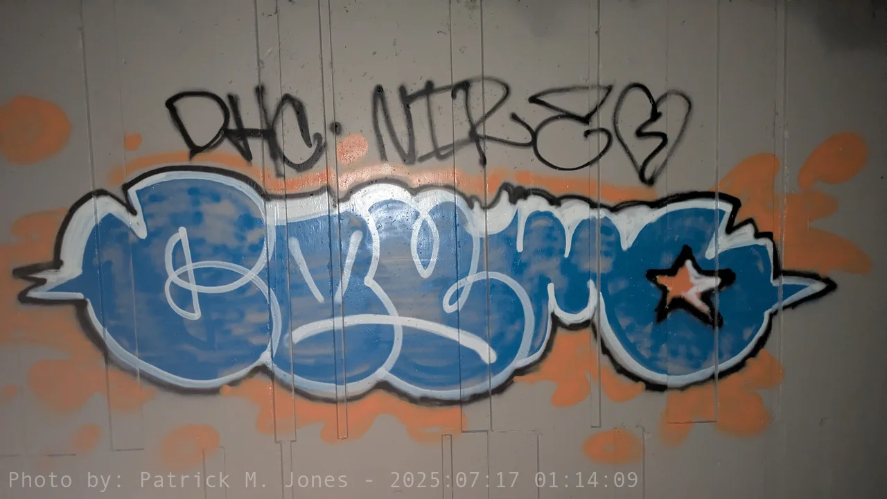 Blue Cosmo fill with white 3-D effect and orange splatter